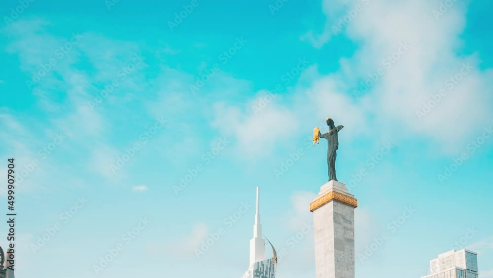 Batumi, Adjara, Georgia. Building Of Black Sea Technological University Of Batumi, Statue Of Medea In Europe Square In Evening. hyperlapse Urban street timelapse. Batumi, Adjara, Georgia. Building Of Black Sea Technological University Of Batumi, Statue Of Medea In Europe Square In Evening. hyperlapse Urban street timelapse.