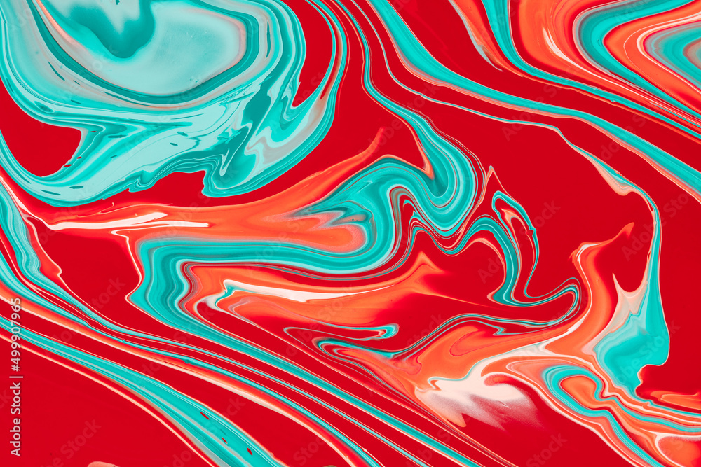 A fluid art texture is created by the combination of colorful paints. A liquid abstract background with colored waves and swirling shapes on it. Fluent backdrop composition with blending dyes.