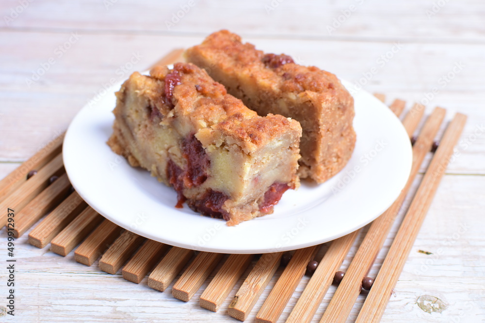 Fluffy bread cake with guava flavor on wooden background Fluffy bread cake with guava flavor on wooden background