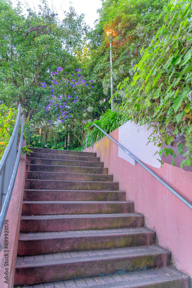 Outdoor stairs metal handrail on the stairs with bricks at San Francisco, California Outdoor stairs metal handrail on the stairs with bricks at San Francisco, California