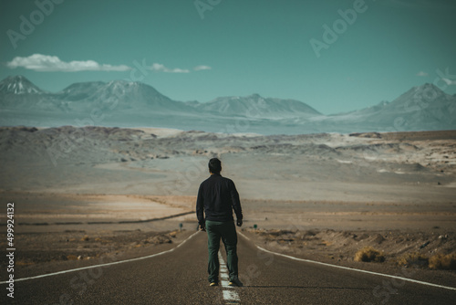 person walking on the road