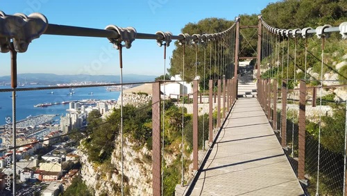 Walking across the Windsor suspension bridge in Gibraltar. POV