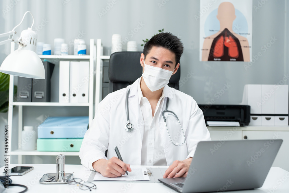 Portrait of Asian male doctor wear protective face mask in hospital. Portrait of Asian male doctor wear protective face mask in hospital.