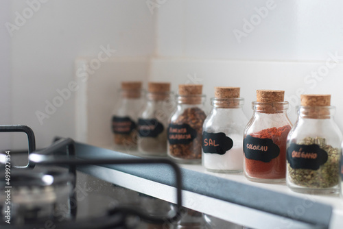 Small jars of seasoning with paprika and salt