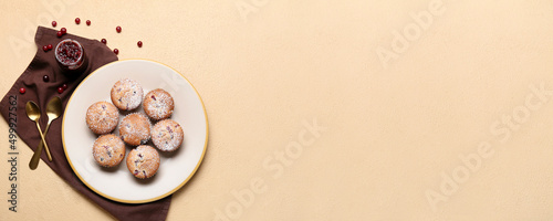 Plate with tasty cranberry muffins on light background with space for text