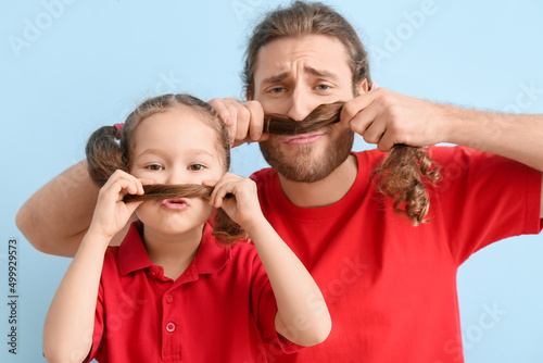Funny man and her little da...
