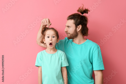 Funny man and her little da...
