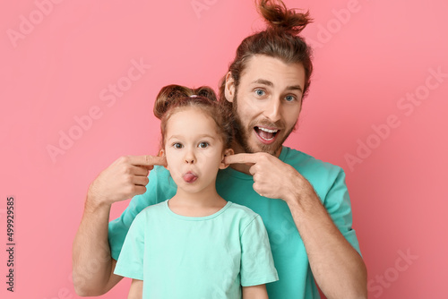 Funny man and her little da...