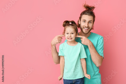 Funny man and her little da...