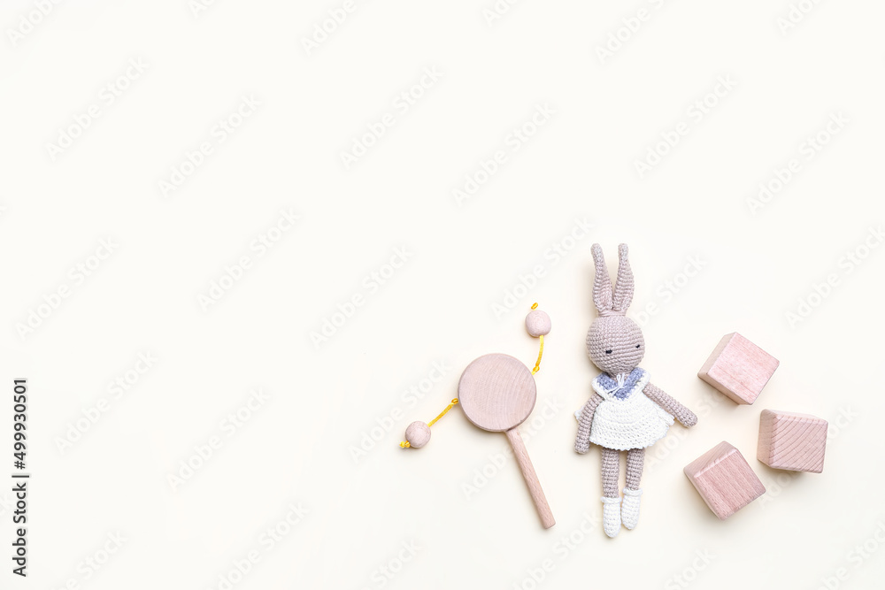 Wooden cubes with baby toys on white background Wooden cubes with baby toys on white background