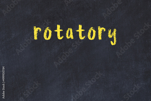 College chalk desk with the word rotatory written on in photo