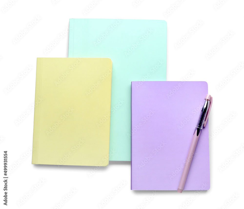 Notebooks and pen isolated on white Notebooks and pen isolated on white