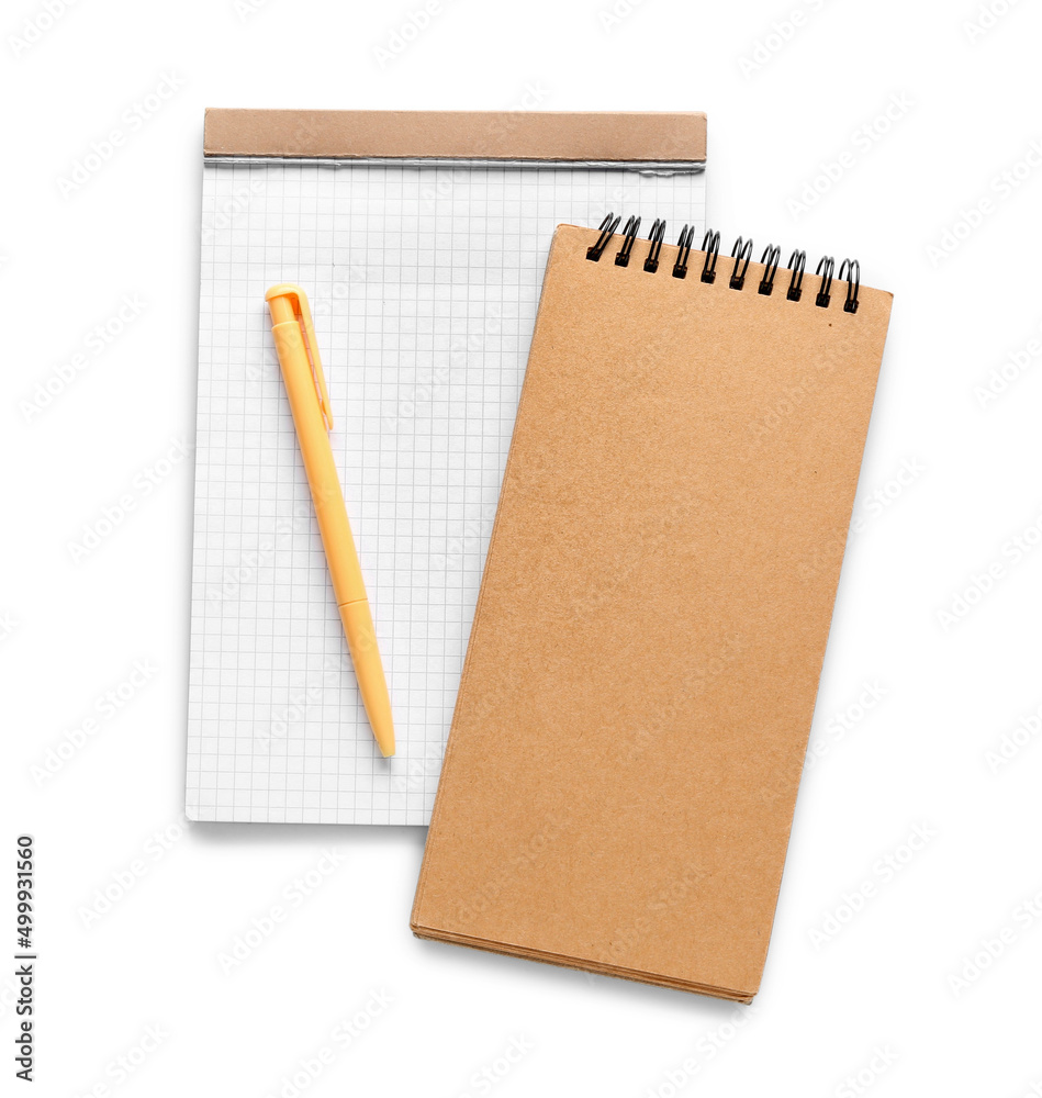 Notebooks and pen isolated on white Notebooks and pen isolated on white