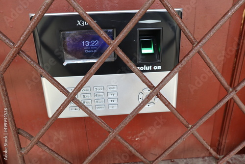 Fingerprint scanner with A wrought iron patterned grid for safety with selective focus