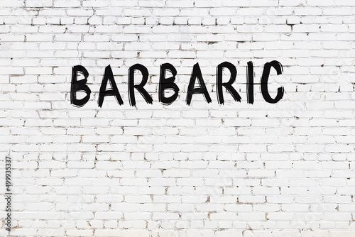 Φωτογραφία Inscription barbaric painted on white brick wall