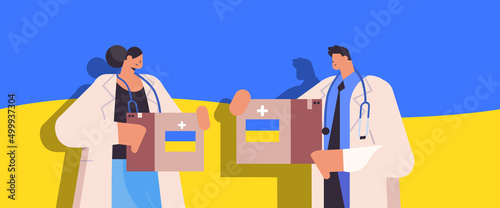 doctors holding help boxes with medical supplies humanitarian aid material assistance governmental help