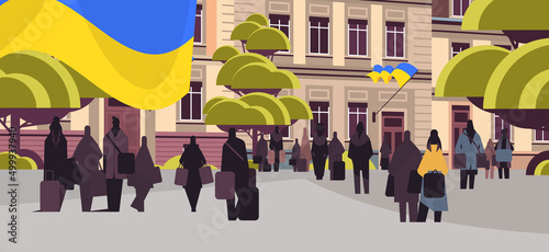 Ukrainian refugees with things fleeing russian aggression against Ukraine stop war concept people searching new homes