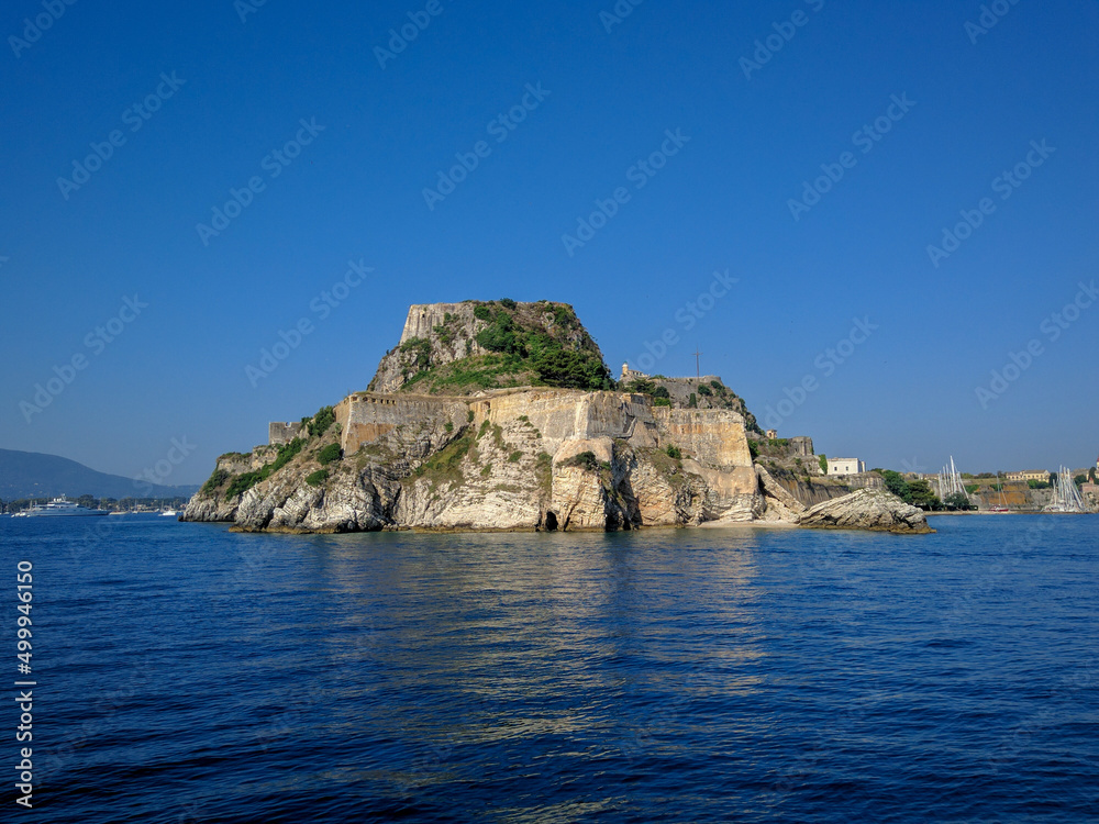 Corfu, Greece - July 7, 2018: Beautiful view from the ship to the old fortress of the island of Corfu against the blue sky. The fortress stands on a high rock. Copy space
