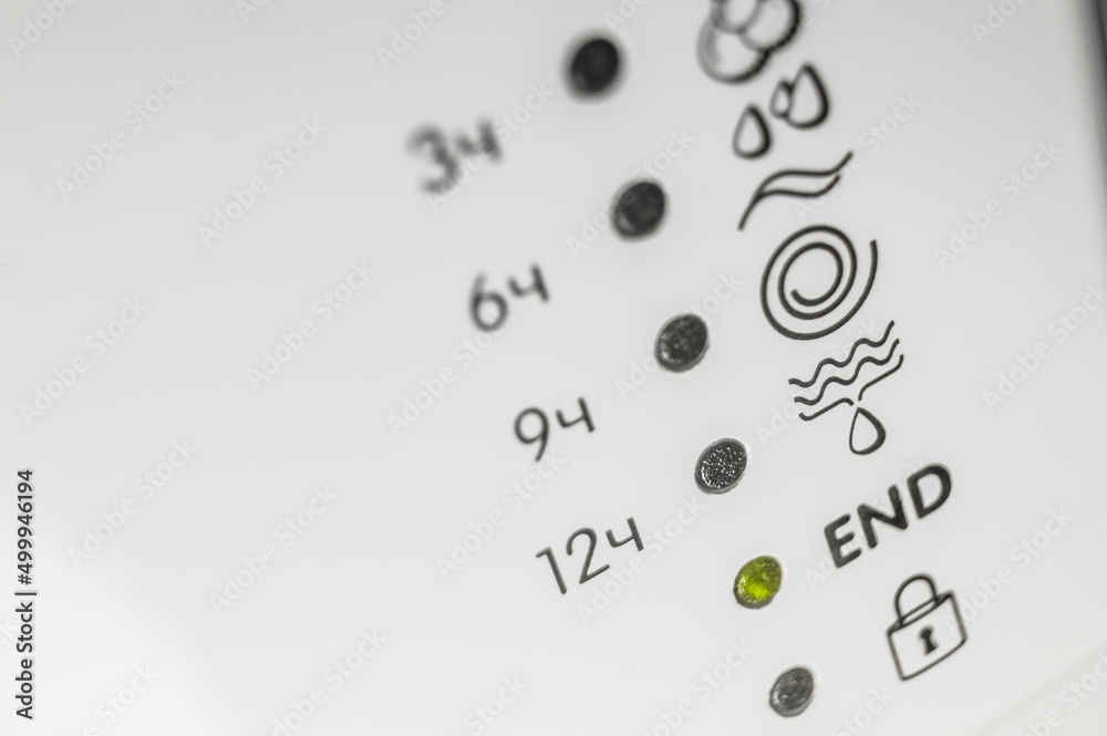 LED indicators of the included washing modes on the control panel of the home washing machine. Icons of washing modes. Selective focus LED indicators of the included washing modes on the control panel of the home washing machine. Icons of washing modes. Selective focus