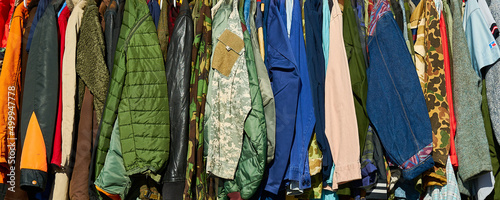 A row of jackets, coats and clothes photo