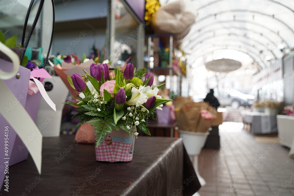 Bright bouquets of flowers with decorative paper on sale. Bright bouquets of flowers with decorative paper on sale.