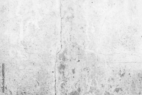 Gray dirty cement background. interior old rough surface texture dark black white floor stone. dirty pattern floor wall and soft light material inside backdrop. loft room ground raw house buiding.