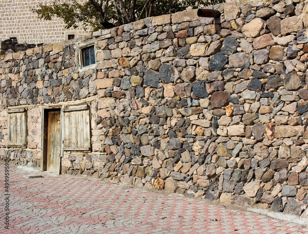 Old stone house on the streets, ancient Armenian house made of stone and straw Old stone house on the streets, ancient Armenian house made of stone and straw