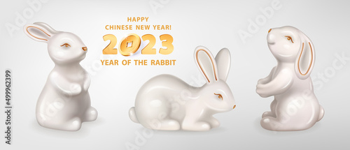 Rabbit is a symbol of the 2023 Chinese New Year. Set of three figurines of white ceramic Rabbits isolated on a white background. Vector realistic 3D illustration of decorative Bunny