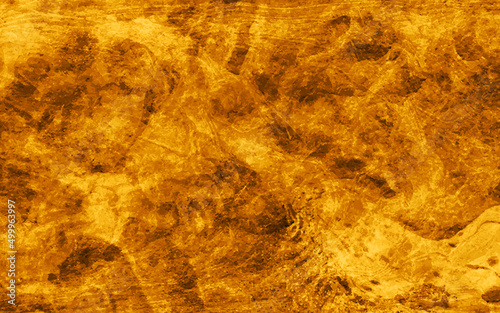 Abstract grunge textured dark gold color abandoned old concrete wall surface background, gold distressed vintage grunge in faded gold spotlight design, abstract textured design from gold dark to light