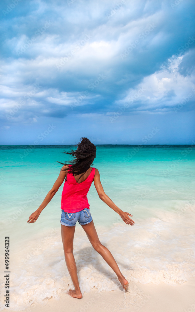 Young African American female enjoying Bahamas beach vacation