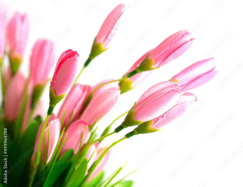 Artificial pink flowers on a white Artificial pink flowers on a white