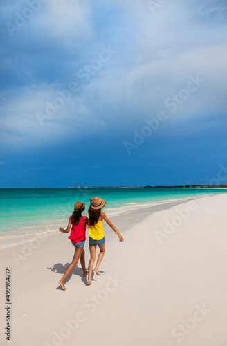 Girls wearing Panama hats enjoying Caribbean island vacation