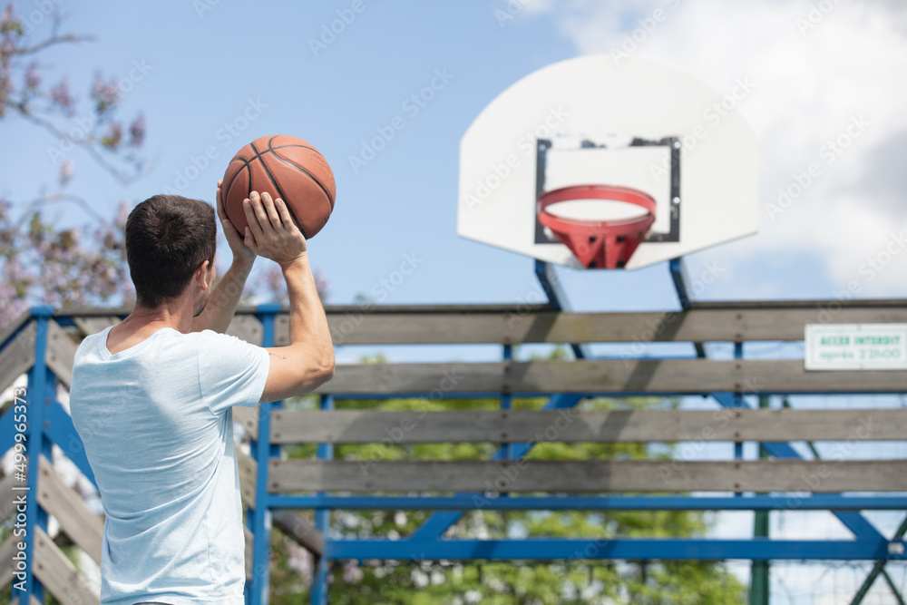 basketball player jumping to dunk