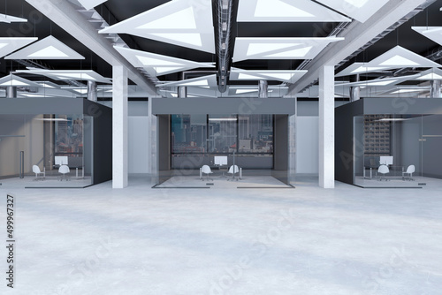 Фотография Modern concrete office corridor interior with glass doors with city view reflections