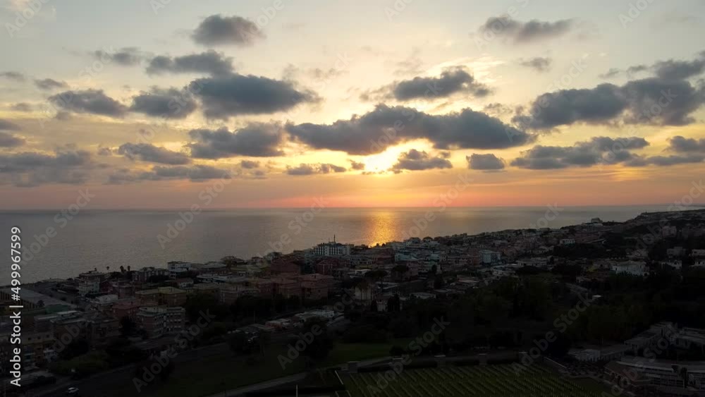 Aerial shot of a sunset on an Italian seacost, descending view Aerial shot of a sunset on an Italian seacost, descending view