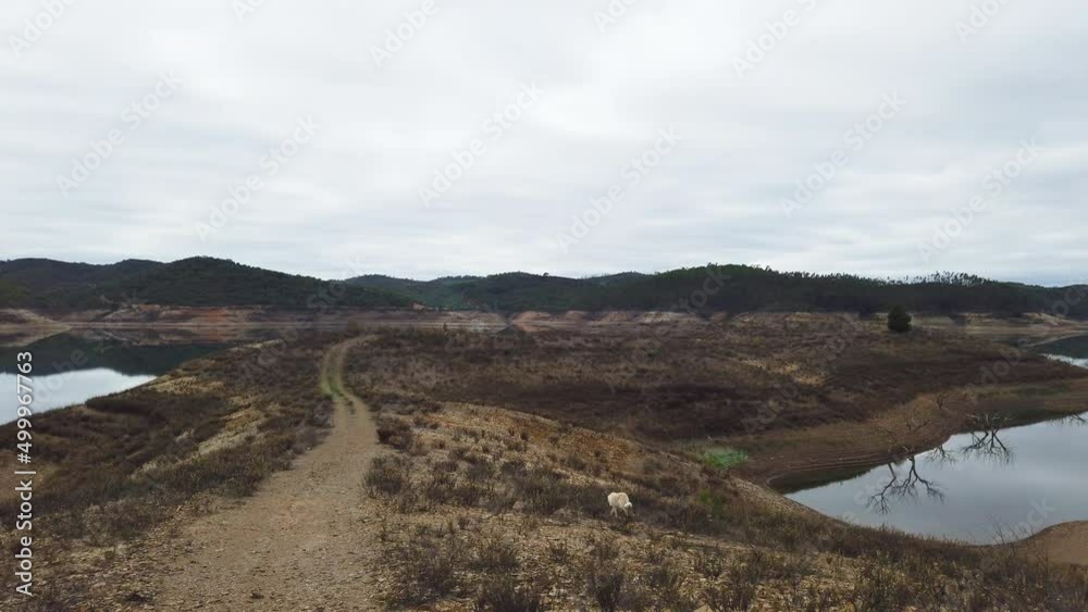 drainage basin in the Algarve, beautiful mountains in the background. A water supply from nature for the people. drainage basin in the Algarve, beautiful mountains in the background. A water supply from nature for the people.