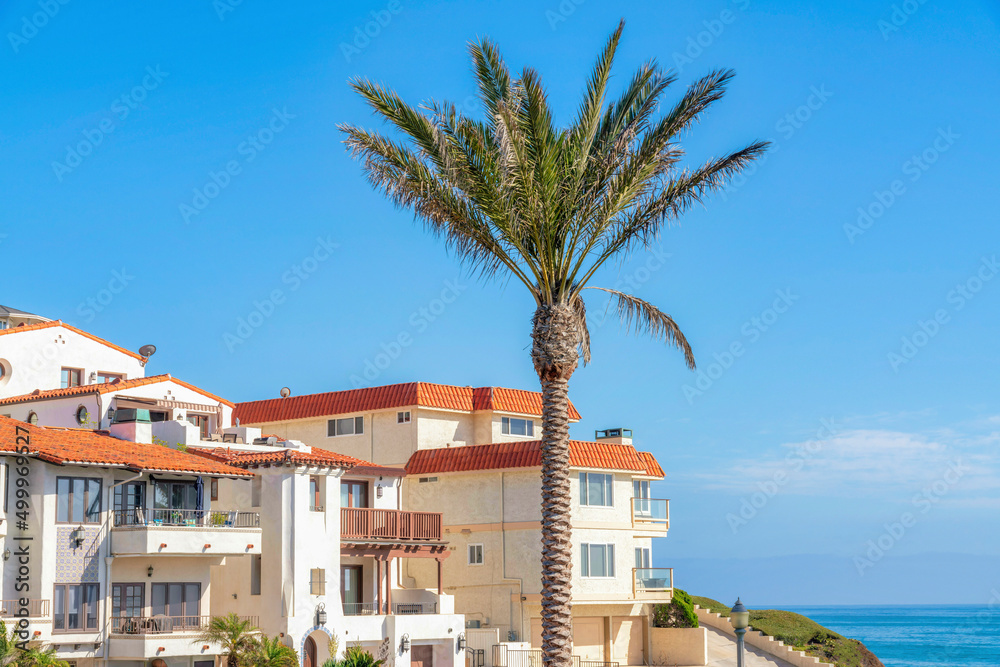Apartment building with mediterranean style exterior and a view of ocean in San Clemente, CA