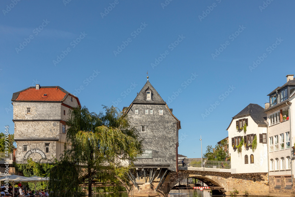 Bad Kreuznach, Brueckenhaeuser, Germany under blue sky with restaurant