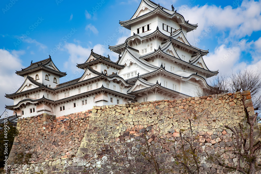 Amazing Japanese national architecture - Himeji castle or White Egret Castle standing on large foundation from a stone. It is a popular sightseeing location in Japan, and is listed as an UNESCO world Amazing Japanese national architecture - Himeji castle or White Egret Castle standing on large foundation from a stone. It is a popular sightseeing location in Japan, and is listed as an UNESCO world