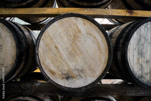 Oak barrels stacked with tequila ready for maturation