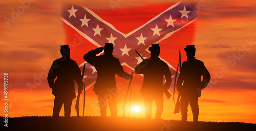 Confederate flag and soldier on sunset background. Confederate heroes day. photo
