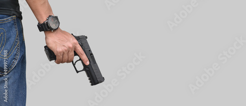 Isolated 9mm pistol gun holding in right hand of gun shooter with clipping paths.