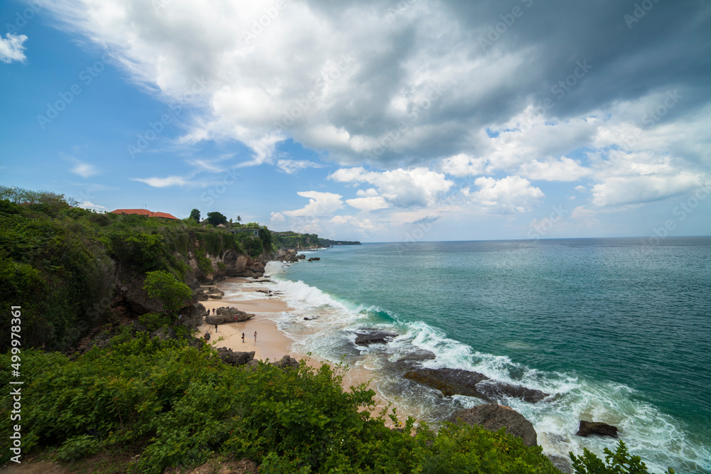 High cliff on tropical beach in Bali, Indonesia High cliff on tropical beach in Bali, Indonesia