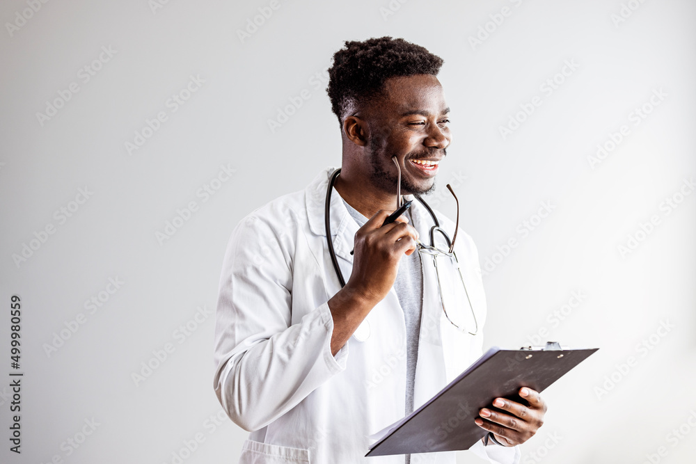 Portrait of confident black doctor. Smiling african american doctor with stethoscope at medical clinic. Happy healthcare worker at modern hospital. Portrait of happy african doctor at private clinic Portrait of confident black doctor. Smiling african american doctor with stethoscope at medical clinic. Happy healthcare worker at modern hospital. Portrait of happy african doctor at private clinic