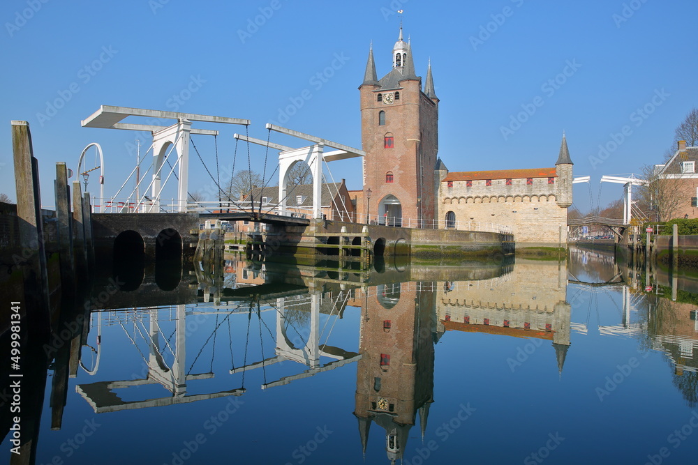 Reflections of Zuidhavenpoort, the Southern harbor gate, with a drawbridge, Zierikzee, Zeeland, Netherlands
