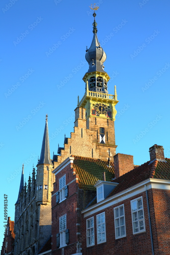 Fototapeta premium The Stadhuis (town hall) with its impressive clock tower in Veere, Zeeland, Netherlands