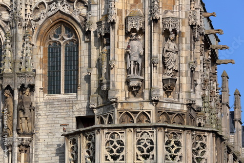 Close-up on statues and ornaments (Dutch Gothic architecture) on the external facade the gothic styled Stadhuis (town hall), located on the Markt (main Square) in Middelburg, Zeeland, Netherlands photo