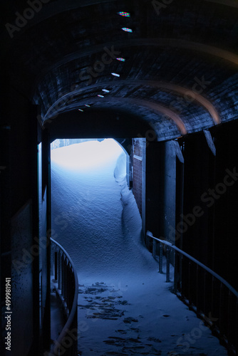 Fototapeta Heavy weather, snow covered entrance for underground passage