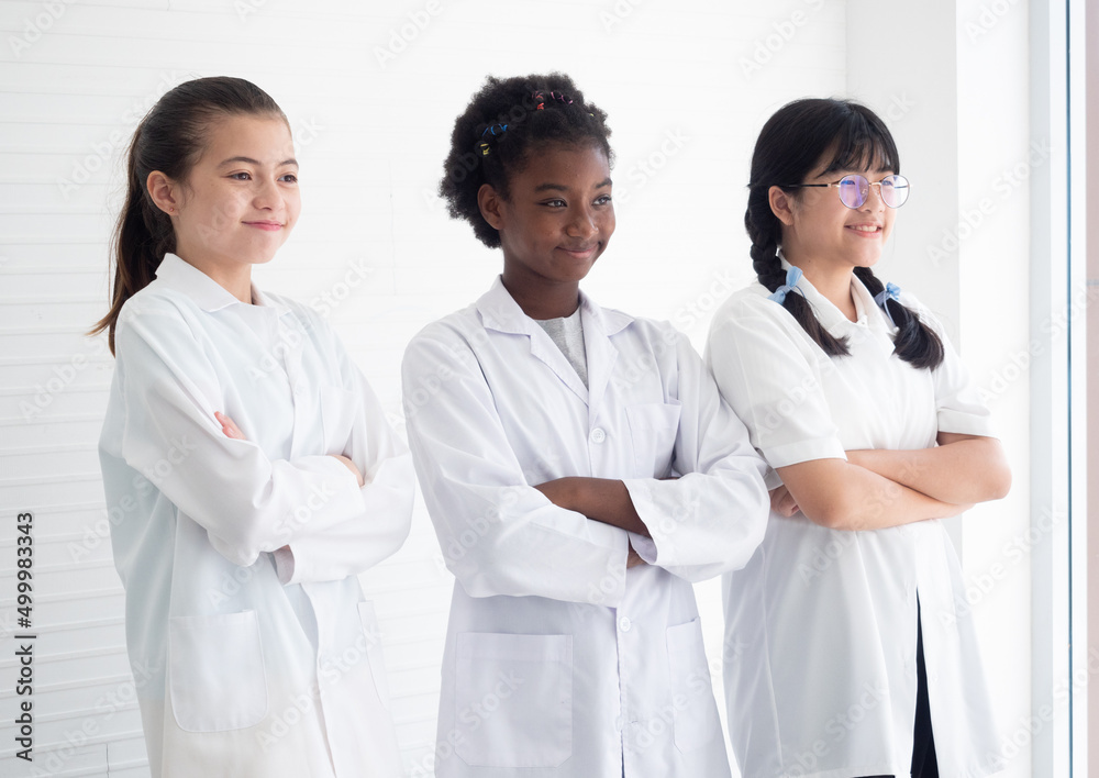 Group of diversity girl scientists standing with arms crossed in the laboratory. Early development of children. Scientific experiment and Research concept. Group of diversity girl scientists standing with arms crossed in the laboratory. Early development of children. Scientific experiment and Research concept.