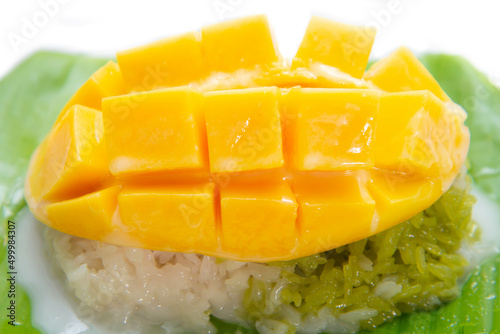 Mango with sticky rice topping with coconut milk sauce